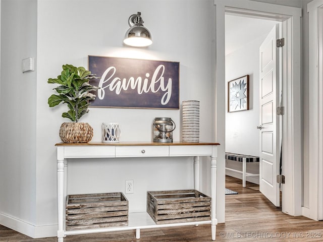 room details with baseboards and wood finished floors