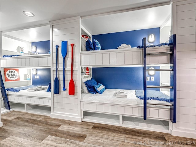 bedroom featuring wood finished floors