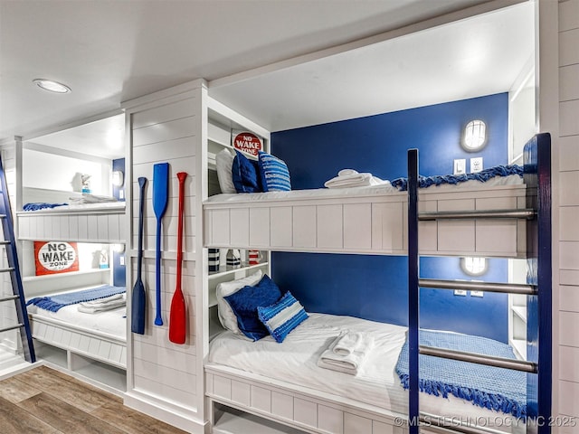 bedroom featuring wood finished floors