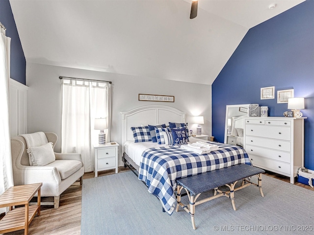 bedroom with lofted ceiling, wood finished floors, and ceiling fan