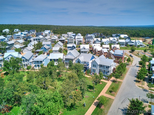 birds eye view of property with a residential view