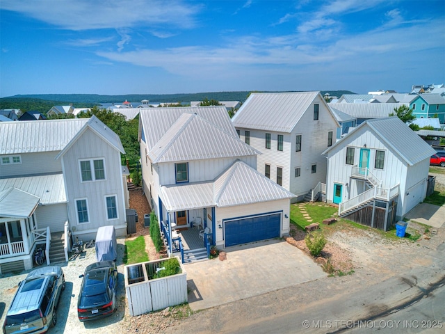 birds eye view of property with a residential view