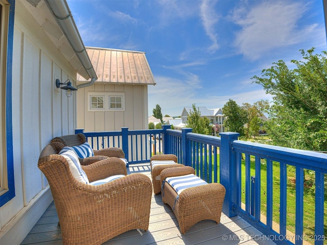 wooden terrace featuring a residential view