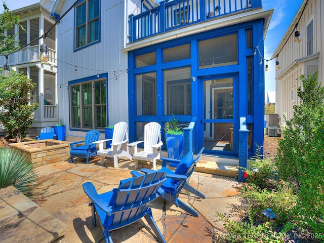 view of patio featuring a balcony