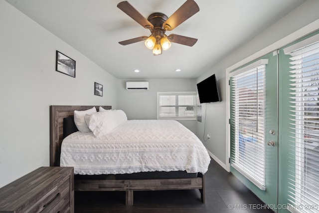 bedroom featuring dark wood-type flooring, baseboards, an AC wall unit, recessed lighting, and a ceiling fan