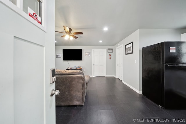 living area featuring recessed lighting, baseboards, ceiling fan, and dark wood-style flooring