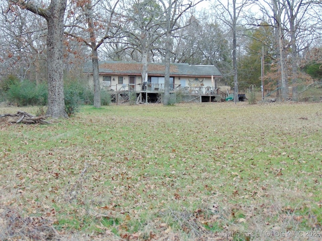 view of yard featuring a wooden deck