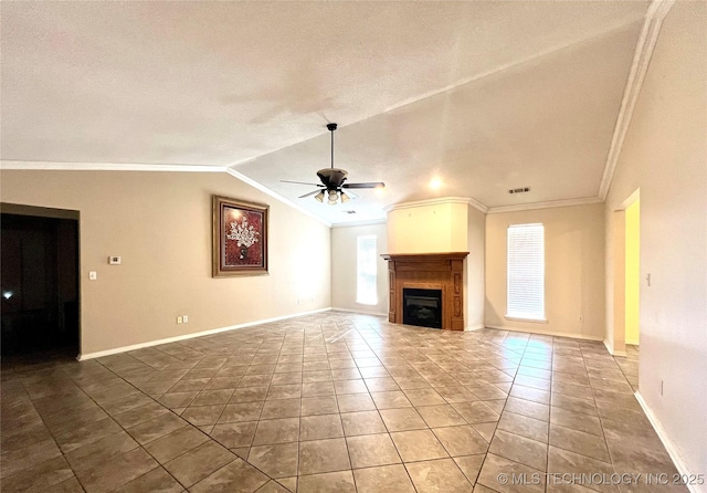 unfurnished living room with vaulted ceiling, ornamental molding, a fireplace, and ceiling fan