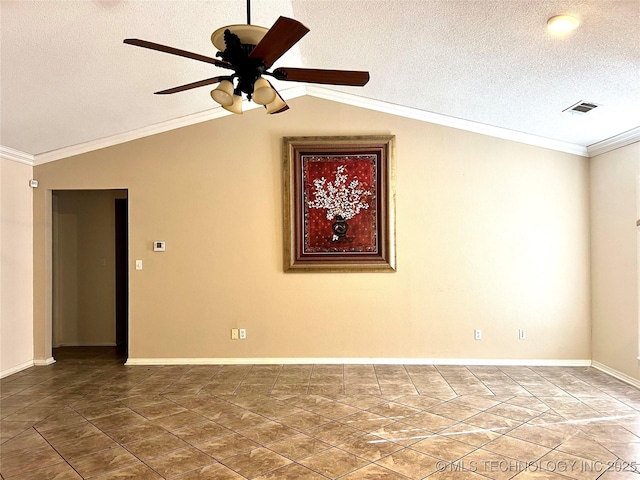 spare room with a ceiling fan, visible vents, vaulted ceiling, a textured ceiling, and crown molding