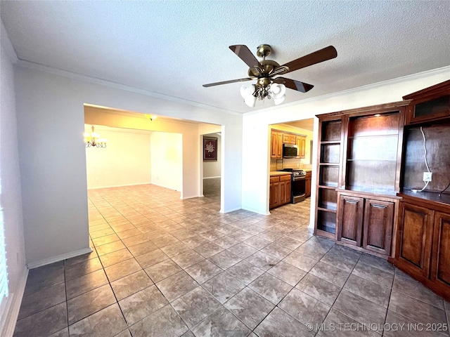 interior space with open shelves, appliances with stainless steel finishes, a textured ceiling, crown molding, and ceiling fan with notable chandelier