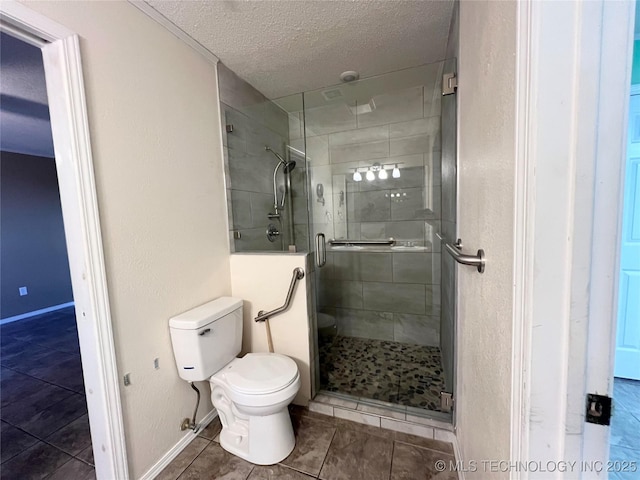 full bath featuring baseboards, tile patterned flooring, a shower stall, a textured ceiling, and toilet