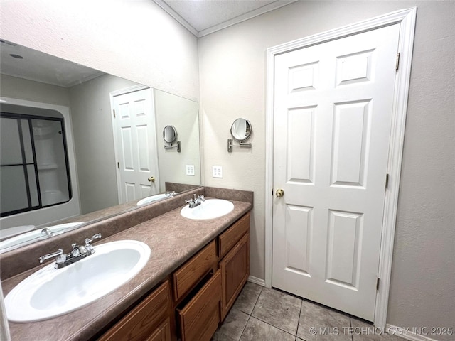 bathroom with a sink, double vanity, and tile patterned flooring