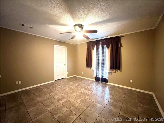 empty room with visible vents, baseboards, ceiling fan, tile patterned flooring, and ornamental molding