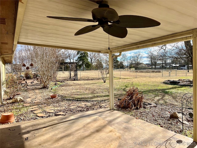 view of patio / terrace featuring ceiling fan and fence