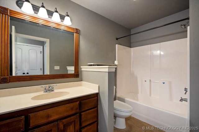 bathroom with vanity, shower / bathing tub combination, toilet, and tile patterned floors