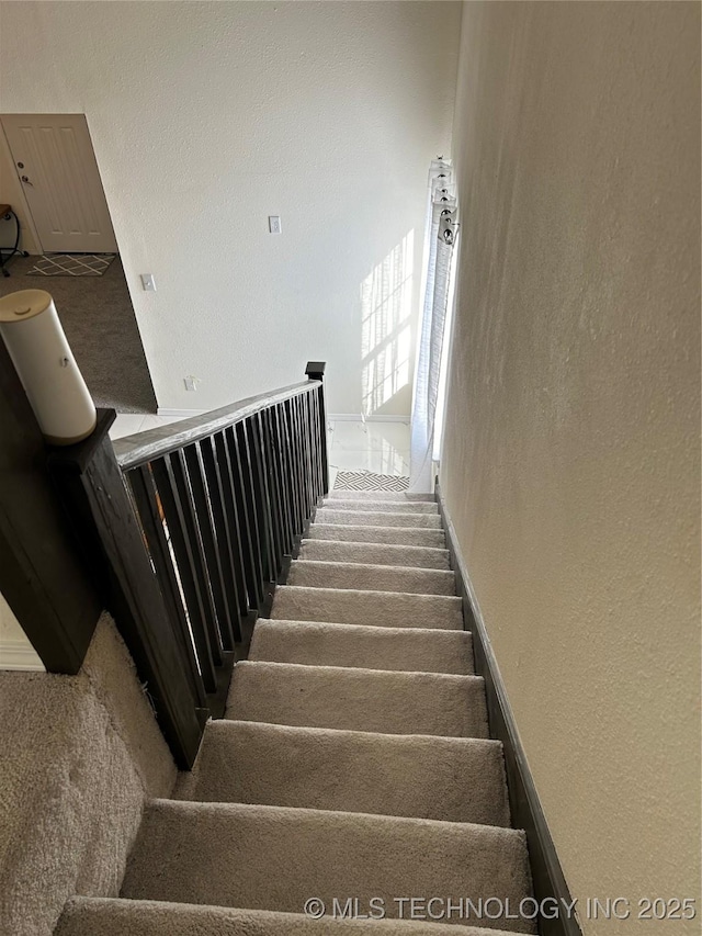 stairway with carpet flooring