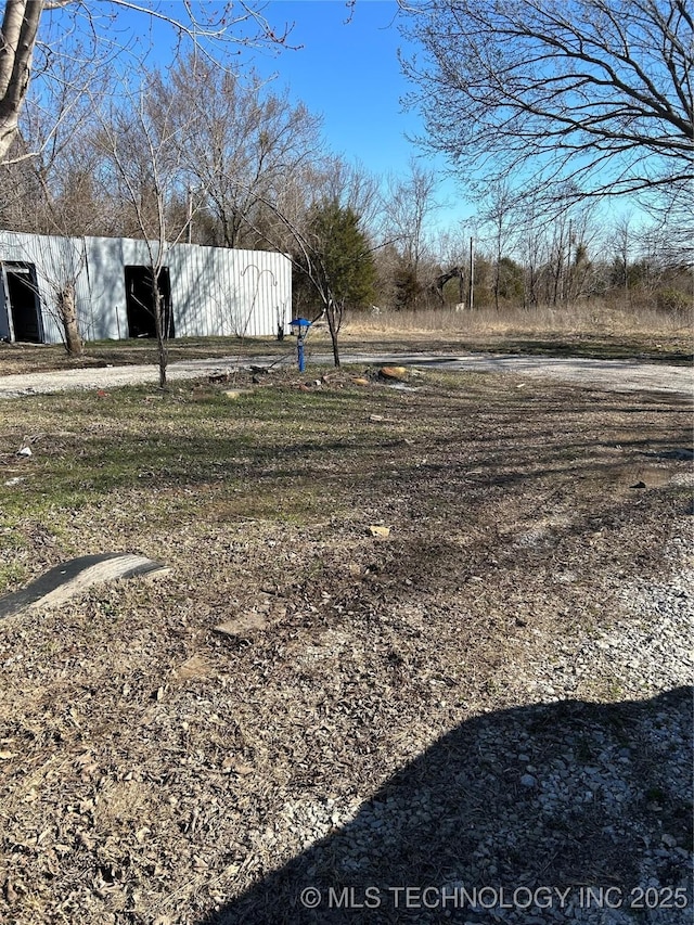 view of yard with an outbuilding and an outdoor structure