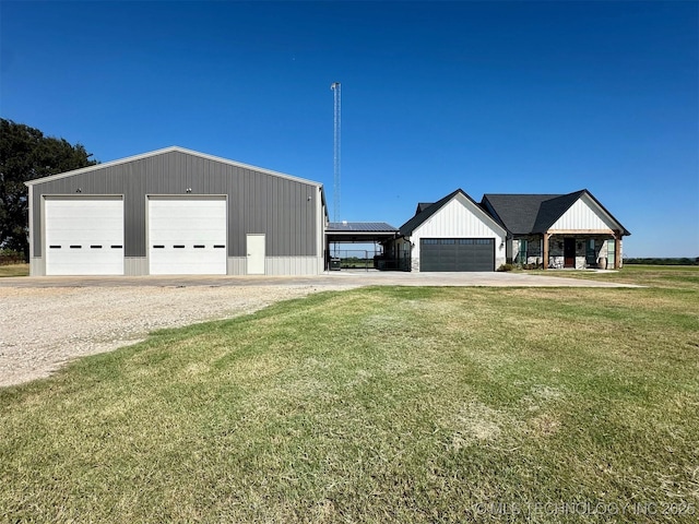 exterior space with a yard and a garage