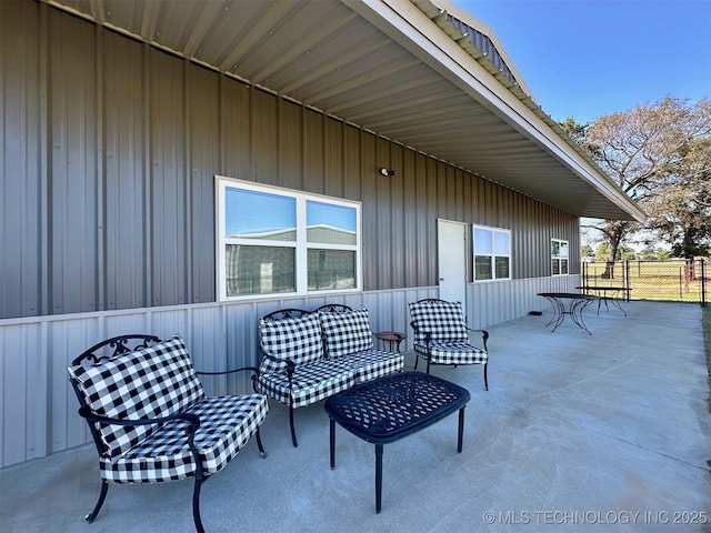 view of patio featuring fence