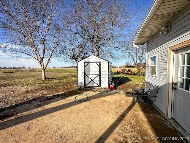 view of shed featuring a rural view