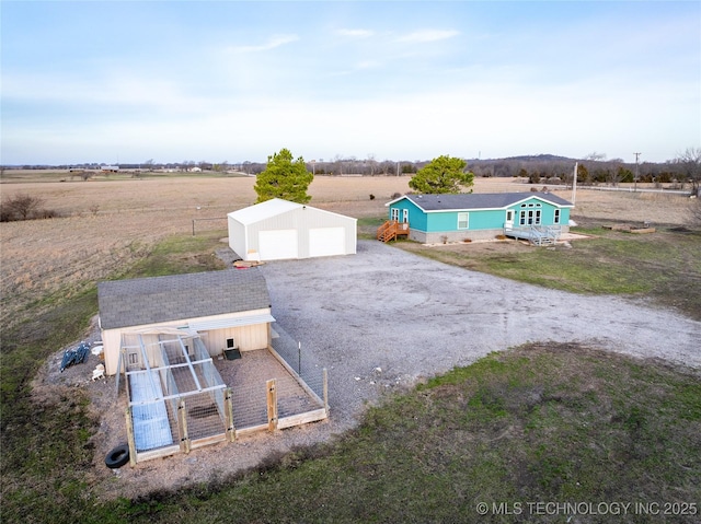 birds eye view of property featuring a rural view