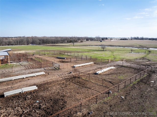 birds eye view of property with a rural view