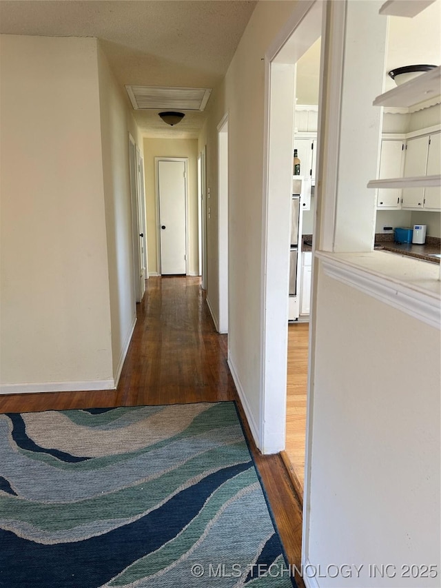 339 W 62nd St N, Tulsa, OK 74126 - hall with baseboards and wood finished floors