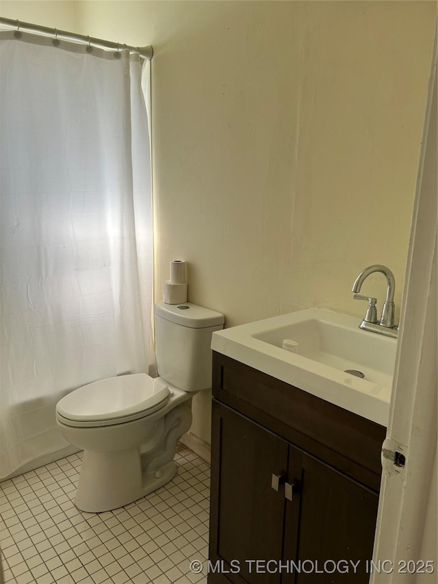 339 W 62nd St N, Tulsa, OK 74126 - full bathroom featuring tile patterned floors, toilet, and vanity