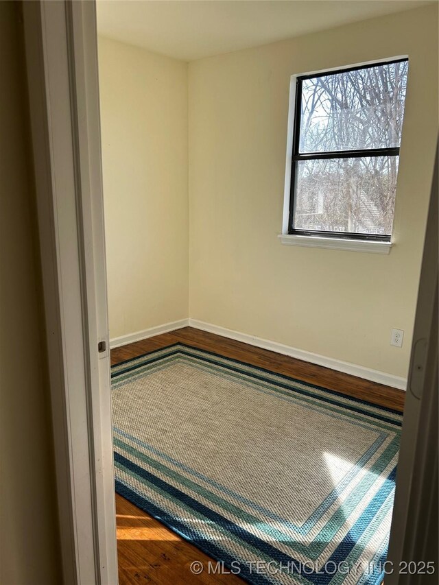 339 W 62nd St N, Tulsa, OK 74126 - unfurnished room featuring wood finished floors and baseboards