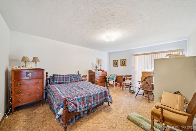 bedroom featuring a textured ceiling and carpet