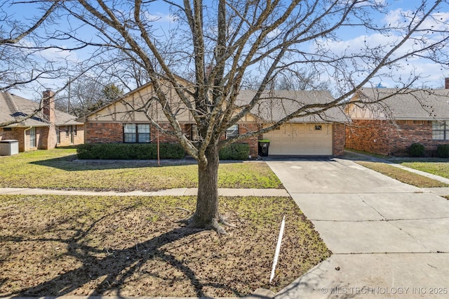 view of front of house with a front yard, an attached garage, brick siding, and concrete driveway