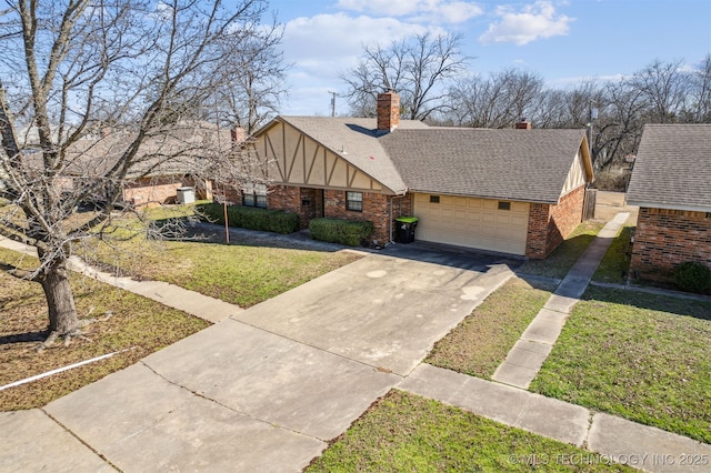 tudor-style house with brick siding, a front yard, roof with shingles, a garage, and driveway