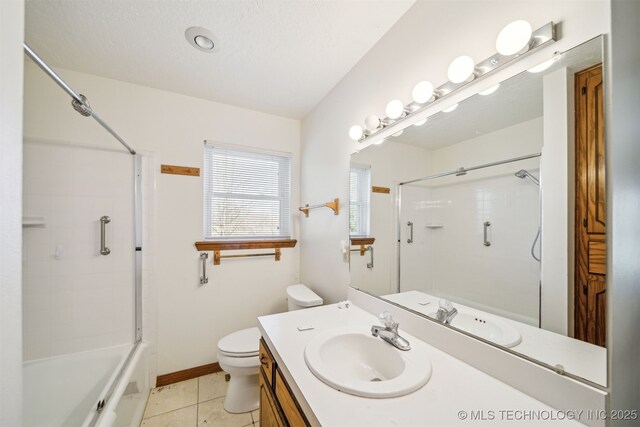 full bath with tile patterned floors, toilet, vanity, and baseboards