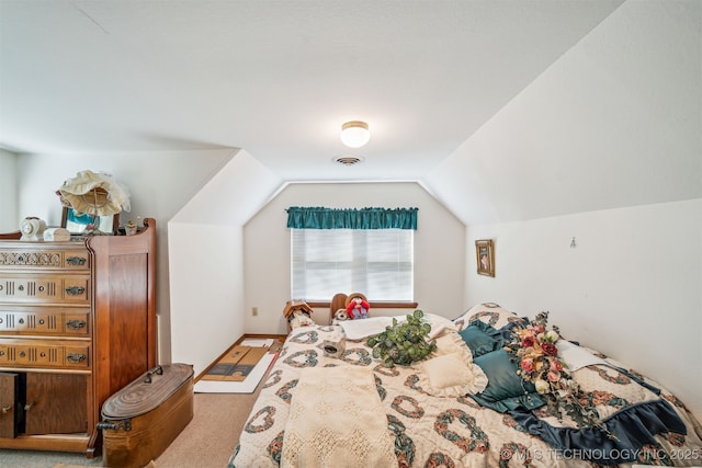 carpeted bedroom with vaulted ceiling and visible vents