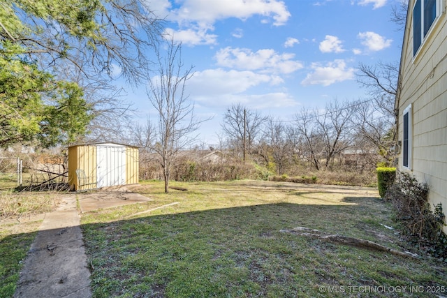 view of yard featuring a storage shed and an outdoor structure