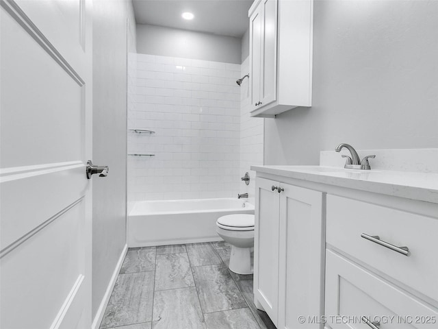 full bathroom featuring toilet, bathtub / shower combination, and vanity