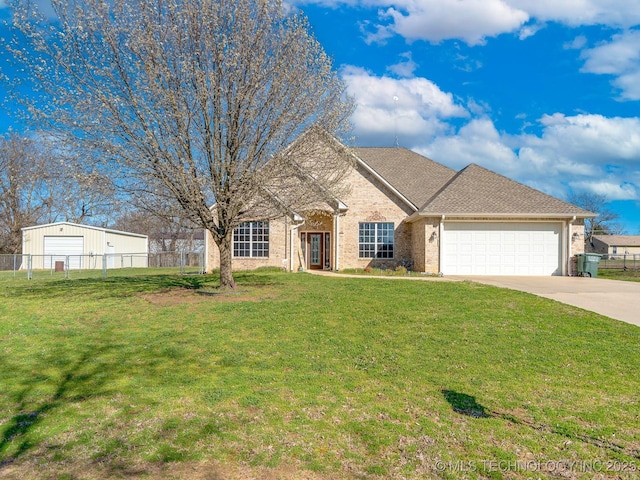 view of front of house with brick siding, a front lawn, fence, concrete driveway, and a garage