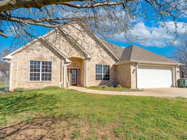 view of front of home with brick siding, a front yard, roof with shingles, a garage, and driveway