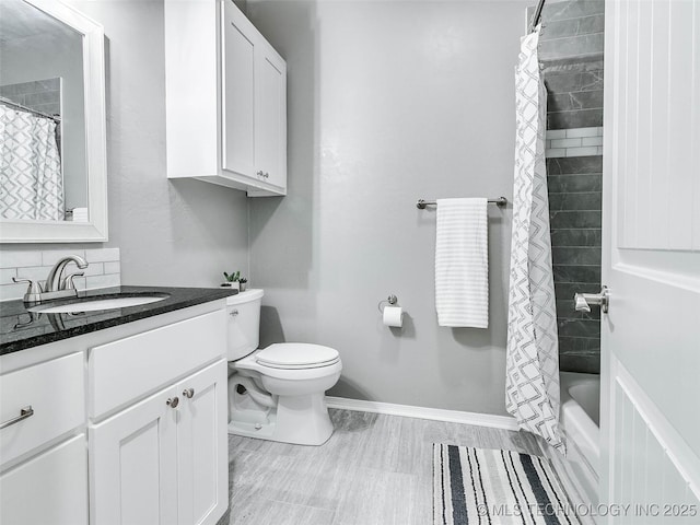 full bathroom with vanity, a bath, baseboards, curtained shower, and toilet