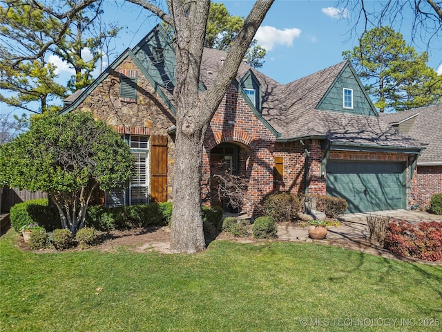 view of front of house with a front lawn, fence, a shingled roof, a garage, and brick siding