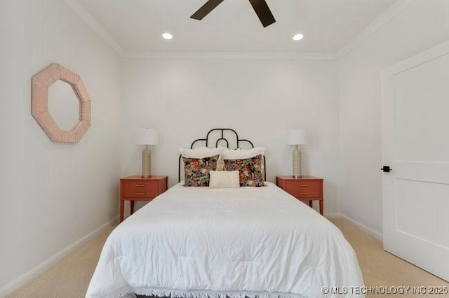 bedroom featuring baseboards, light colored carpet, and crown molding