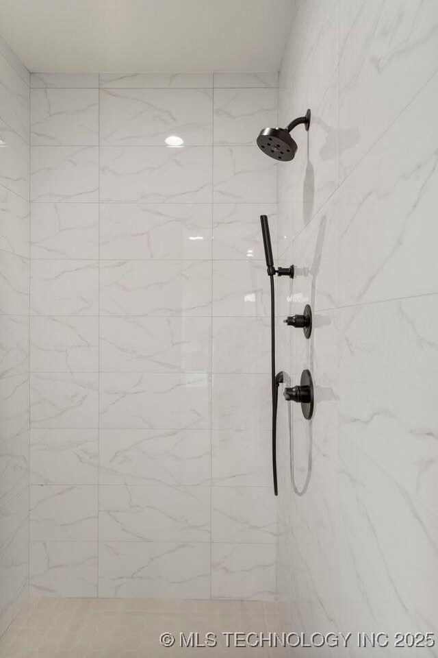 room details with a marble finish shower