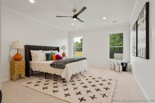 carpeted bedroom featuring recessed lighting, baseboards, and crown molding