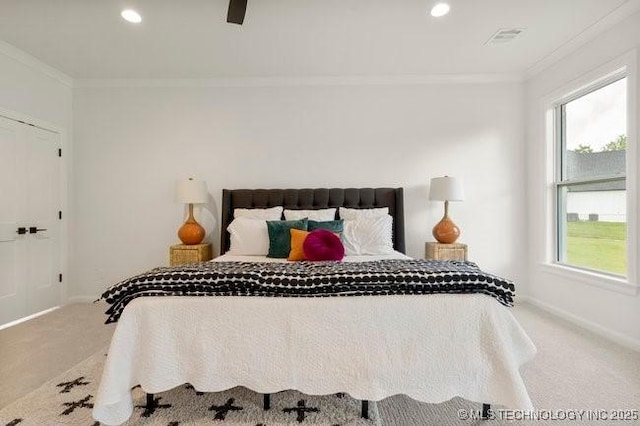 bedroom with recessed lighting, crown molding, and carpet floors