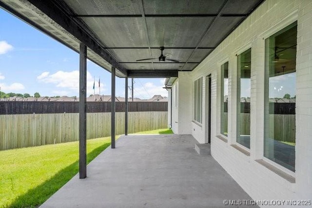 view of patio featuring a ceiling fan and fence