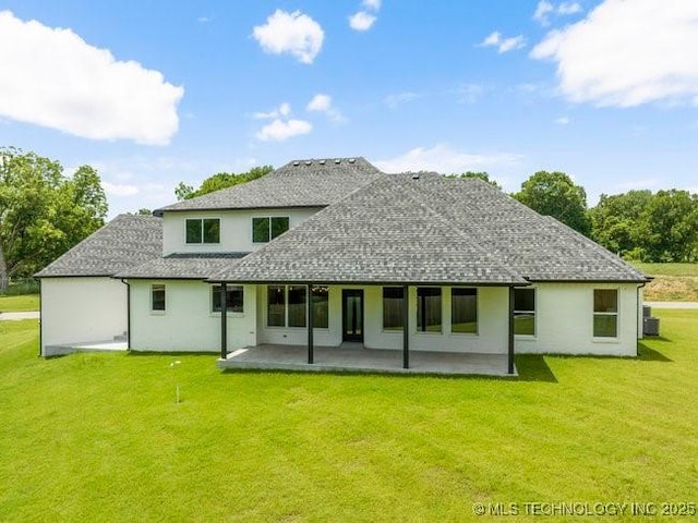 back of house with cooling unit, a lawn, a shingled roof, and a patio area