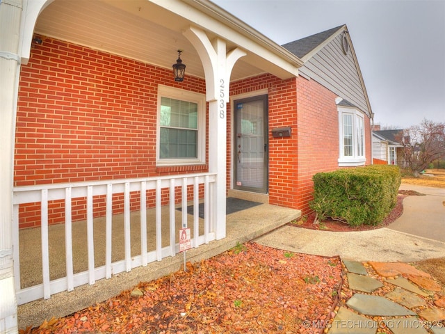 property entrance with brick siding