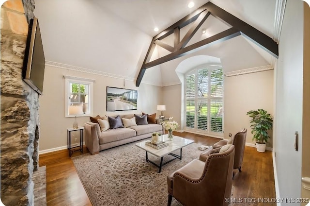 living room with recessed lighting, baseboards, high vaulted ceiling, and wood finished floors