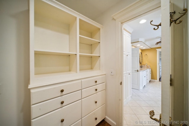 interior space featuring light tile patterned floors and recessed lighting