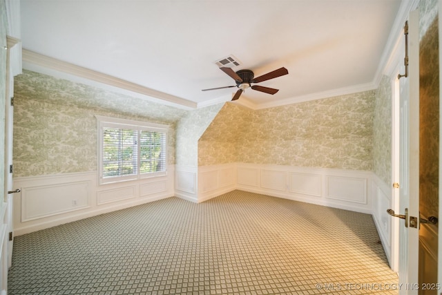 219 E 28th St, Tulsa, OK 74114 - bonus room with a ceiling fan, a wainscoted wall, a decorative wall, and wallpapered walls